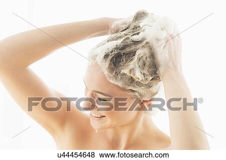 Beautiful woman washing hair View Large Photo Image Stock Photo - Beautiful woman washing hair. Fotosearch