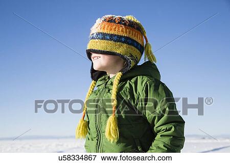 Boy (4-5) enjoying winter outdoors View Large Photo Image Stock Photo - Boy (4-5) enjoying winter outdoors. Fotosearch