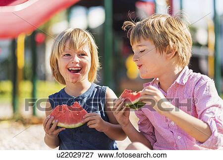 Boys (4-5, 8-9) playing on playground View Large Photo Image Stock Photo - Boys (4-5, 8-9) playing on playground. Fotosearch