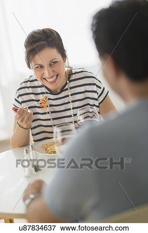 Couple eating spaghetti View Large Photo Image Stock Photo - Couple eating spaghetti. Fotosearch