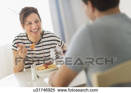 Couple eating spaghetti View Large Photo Image Stock Photography - Couple eating spaghetti. Fotosearch