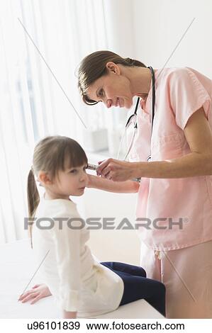 Doctor examining girl (4-5) View Large Photo Image Stock Photo - Doctor examining girl (4-5). Fotosearch