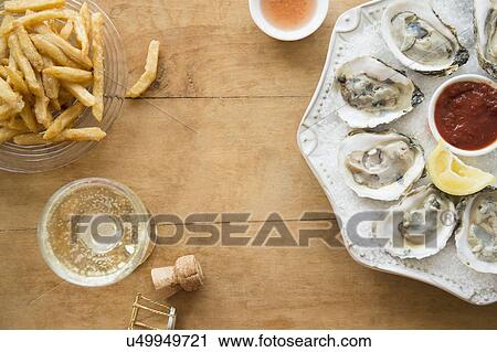 Elevated view of plate with oysters View Large Photo Image Stock Image - Elevated view of plate with oysters . Fotosearch