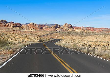 Empty road leading through desert View Large Photo Image Stock Image - Empty road leading through desert. Fotosearch