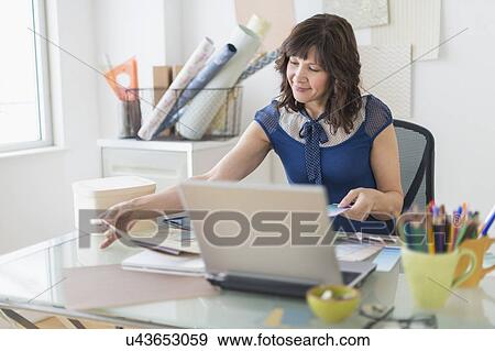 Female business owner at work View Large Photo Image Stock Photo - Female business owner at work. Fotosearch