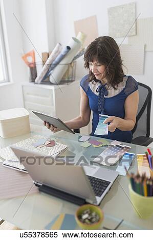 Stock Photography - Female business owner at work. Fotosearch