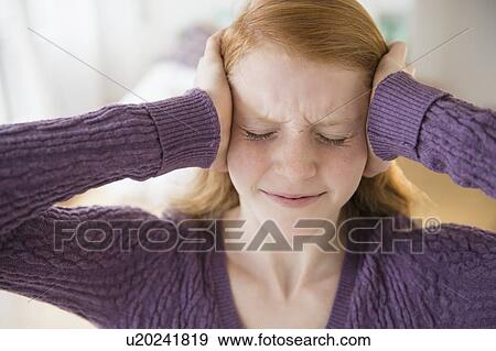 Front view of girl (12-13) with head on head View Large Photo Image Stock Photo - Front view of girl (12-13) with head on head. Fotosearch