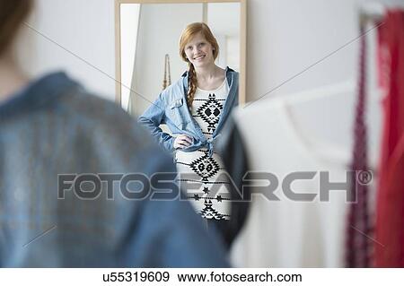 Girl (12-13) getting dress View Large Photo Image Stock Photo - Girl (12-13) getting dress. Fotosearch