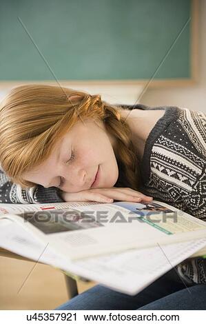 Girl (12-13) sleeping on desk View Large Photo Image Stock Image - Girl (12-13) sleeping on desk. Fotosearch