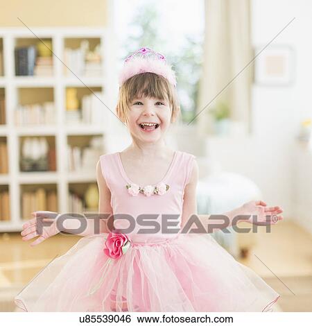 Girl (4-5) wearing tutu dancing in living room View Large Photo Image Stock Photograph - Girl (4-5) wearing tutu dancing in living room. Fotosearch