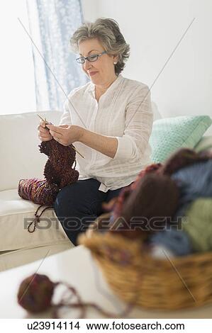 Picture - Mature woman knitting. Fotosearch
