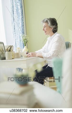Mature woman writing letter View Large Photo Image Stock Image - Mature woman writing letter. Fotosearch
