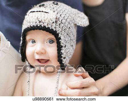 Portrait of baby boy (2-5 months) wearing knit hat View Large Photo Image Stock Image - Portrait of baby boy (2-5 months) wearing knit hat. Fotosearch
