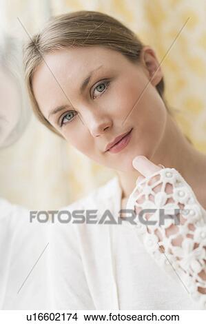 Portrait of blond woman by window View Large Photo Image Picture - Portrait of blond woman by window. Fotosearch