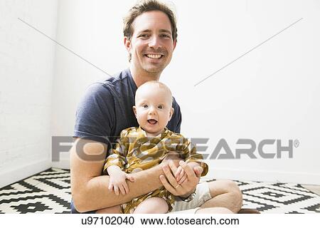 Portrait of father with baby son (2-5 months) View Large Photo Image Stock Image - Portrait of father with baby son (2-5 months). Fotosearch