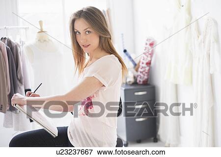 Portrait of female costume designer in studio View Large Photo Image Stock Photo - Portrait of female costume designer in studio. Fotosearch