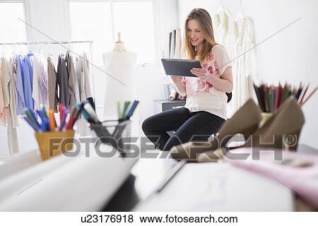 Portrait of female costume designer using digital tablet in studio View Large Photo Image Stock Photo - Portrait of female costume designer using digital tablet in studio. Fotosearch