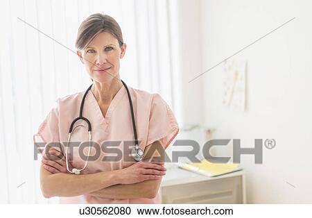 Stock Image - Portrait of female doctor. Fotosearch