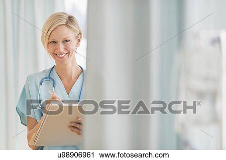 Stock Image - Portrait of female doctor. Fotosearch