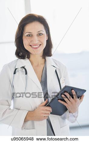Portrait of female doctor View Large Photo Image Stock Photo - Portrait of female doctor. Fotosearch