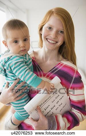 Portrait of girl (12-13) with baby girl (2-5 months) View Large Photo Image Stock Image - Portrait of girl (12-13) with baby girl (2-5 months). Fotosearch