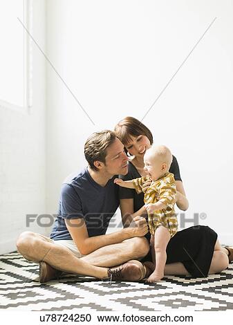 Portrait of parents with baby son (2-5 months) View Large Photo Image Stock Image - Portrait of parents with baby son (2-5 months). Fotosearch