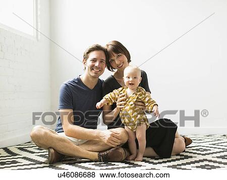 Portrait of parents with baby son (2-5 months) View Large Photo Image Stock Photo - Portrait of parents with baby son (2-5 months). Fotosearch