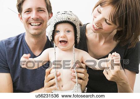 Portrait of parents with baby son (2-5 months) View Large Photo Image Stock Photograph - Portrait of parents with baby son (2-5 months). Fotosearch