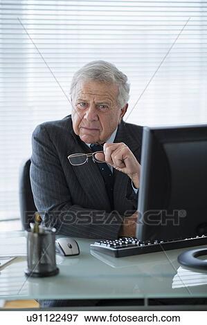 Portrait of senior man in office View Large Photo Image Stock Photo - Portrait of senior man in office. Fotosearch