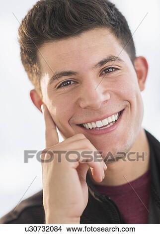 Portrait of smiling young man View Large Photo Image Picture - Portrait of smiling young man. Fotosearch