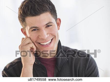 Portrait of smiling young man View Large Photo Image Stock Photo - Portrait of smiling young man. Fotosearch