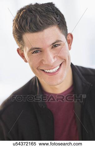 Stock Photography - Portrait of smiling young man. Fotosearch