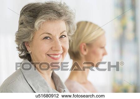 Stock Image - Portrait of two women. Fotosearch