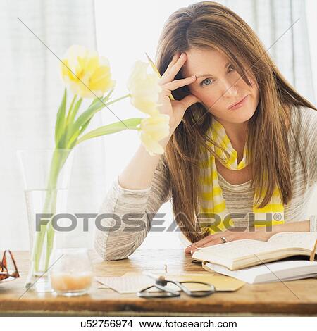 Portrait of woman at desk View Large Photo Image Picture - Portrait of woman at desk. Fotosearch
