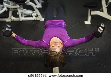 Portrait of woman exercising View Large Photo Image Stock Image - Portrait of woman exercising. Fotosearch