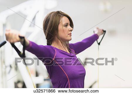 Stock Photograph - Portrait of woman exercising. Fotosearch