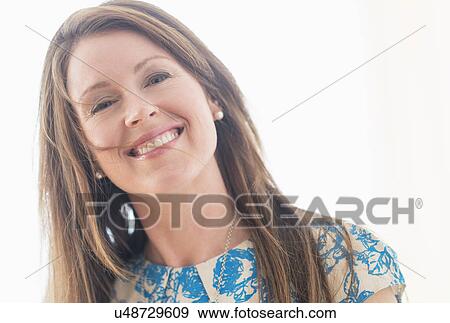 Stock Photo - Portrait of woman smiling. Fotosearch
