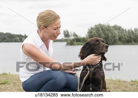 Portrait of woman with dog View Large Photo Image Stock Photography - Portrait of woman with dog. Fotosearch