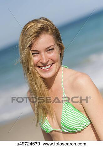 Portrait of young woman on beach View Large Photo Image Stock Photo - Portrait of young woman on beach. Fotosearch
