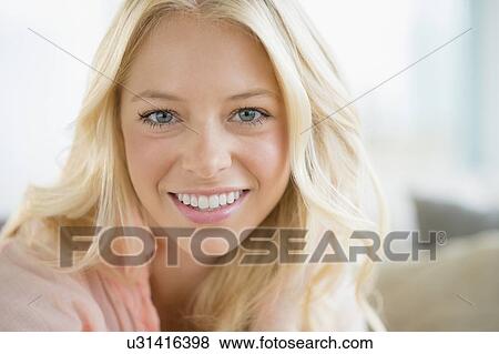 Portrait of young woman smiling View Large Photo Image Stock Photo - Portrait of young woman smiling. Fotosearch