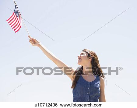 Portrait of young woman with american flag View Large Photo Image Stock Photograph - Portrait of young woman with american flag. Fotosearch