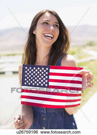 Portrait of young woman with american flag View Large Photo Image Stock Photograph - Portrait of young woman with american flag. Fotosearch