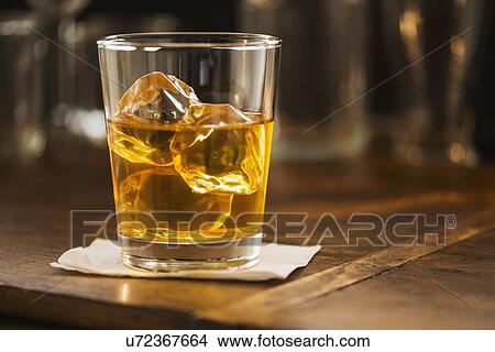 Picture - Scotch with ice. Fotosearch