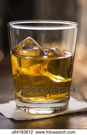 Stock Image - Scotch with ice. Fotosearch