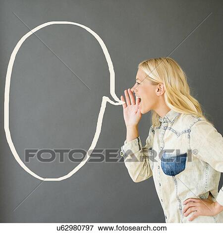 Stock Photo - Side view of young woman shouting. Fotosearch