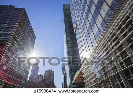 Picture - Skyscrapers with solar flare. Fotosearch
