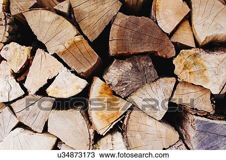 Stock Image - Stack of wooden logs. Fotosearch
