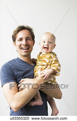 Studio portrait of father with baby son (2-5 months) View Large Photo Image Stock Image - Studio portrait of father with baby son (2-5 months). Fotosearch