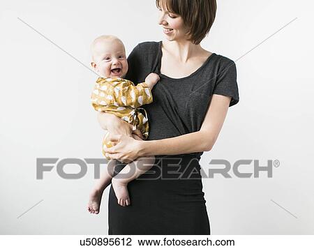 Studio portrait of mother with baby son (2-5 months) View Large Photo Image Stock Image - Studio portrait of mother with baby son (2-5 months). Fotosearch