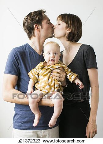 Studio portrait of parents with baby son (2-5 months) View Large Photo Image Stock Image - Studio portrait of parents with baby son (2-5 months). Fotosearch